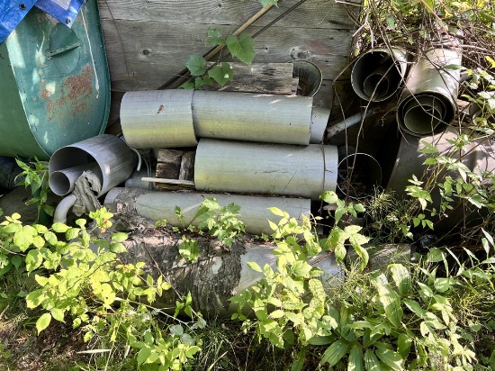 ASSORTED STEEL PIPE NEXT TO SHED