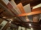 LOT OF MISC. LUMBER ON RAFTERS