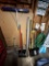 LONG HANDLED TOOL LOT: BROOMS, SHOVELS, RAKE, SNOW RAKE, GARDEN HOSE