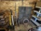 MISC. LOT ALONG BACK WALL: LONG HANDLED TOOLS, STONE HEARTH PAD, MISC. CONDUIT