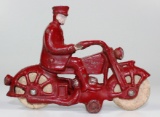 VINTAGE A.C. WILLIAMS CAST IRON MOTORCYCLE WITH COP