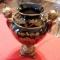 BLACK AND GOLD VASE / URN WITH FLORAL PATTERN AND 2 HANDLES