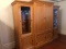 Large light wood entertainment center - three pieces