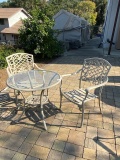 Round glass top metal patio table, off white with four patio chairs