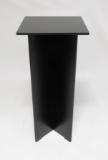 Three black display pedestals of increasing height
