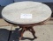 Oval wood Victorian table on castors, hand carved