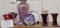 Various glass purple vases and plates