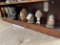 Bottom shelf - five wood angels, Buddah head and more