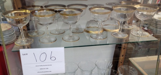 Twelve gold rimmed wine glasses