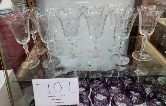 Eleven crystal water goblets (or flutes)
