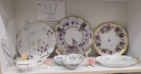 Three flowered plates, two candy dishes, two china roses and more