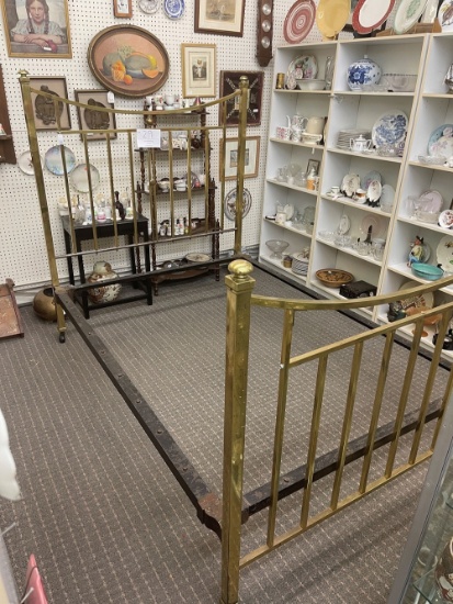 Antique brass bed with metal frame on wheels