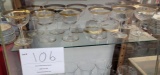 Twelve gold rimmed wine glasses