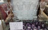Eleven crystal water goblets (or flutes)