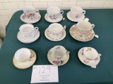 Six extra large cups and saucers, three regular sized cups and saucers