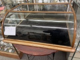 Curved table top display case, black velvet case bottom