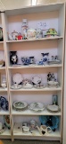 Five shelves of various china and glassware