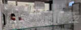 Shelf of crystal goblets and wine glasses, vase