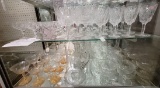 Two shelves of crystal and glassware