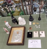 Three Catholic crucifixes, statues, picture of Gabriel, various religious medals