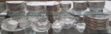 Set of china plates, bowls, dessert dishes with serving pieces