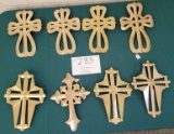 Six gold soft metal crosses