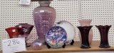 Various glass purple vases and plates