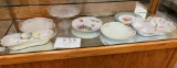 Four china plates, two china serving pieces, crystal cake plate