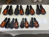 Four large and four small violins in cases, wood collectibles