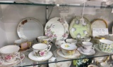 Shelf of tea cups and saucers, plates (approximately 21)
