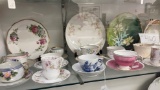 Shelf of tea cups and saucers, plates