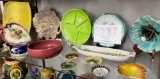 Bright colored ceramic plates, jug, dishes and tiny plates