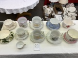 Ten large tea cups (eight with saucers)