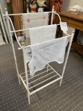 White metal towel stand with 3 towels