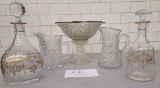 Glass pedestal bowl, crystal decanters w/gold trim, two crystal pitchers