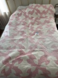 Pink/white hand stitched quilt