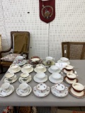 Four large cups and saucers and 15 regular sized cups and saucers