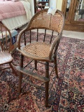 Vintage high chair, cane back and seat