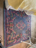 Blue rug with pink and green  66