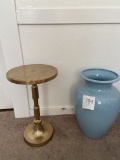 Round top gilt table; blue glass vase
