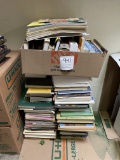 Box of books and stack of books