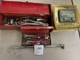 Red tool box with various hand tools and