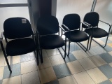 Four black fabric reception chairs