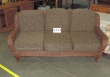 Brown Wicker Sofa Covered In Leopard Fabric