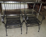 Pair Of Ornate Iron Rocking Chairs