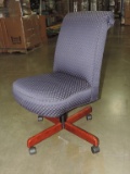 Upholstered Desk Chair On Rollers.