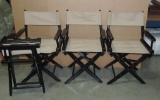 SET OF 4 BLACK AND TAN CLOTH FOLDING DIRECTOR CHAIRS