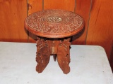 Carved plant stand