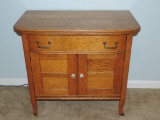 Curved front oak wash stand with one drawer and two doors