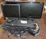 Lot of computer monitors and keyboards